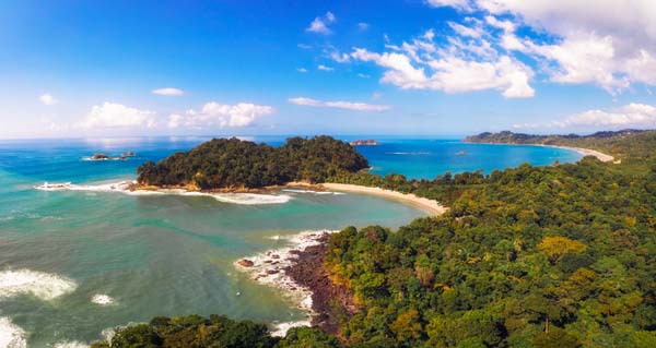 An aerial panorama photo of a beach in Costa Rica.
